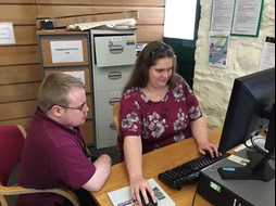 Sian Andrews and Dan Martin working together on the Access Pembrokeshire website